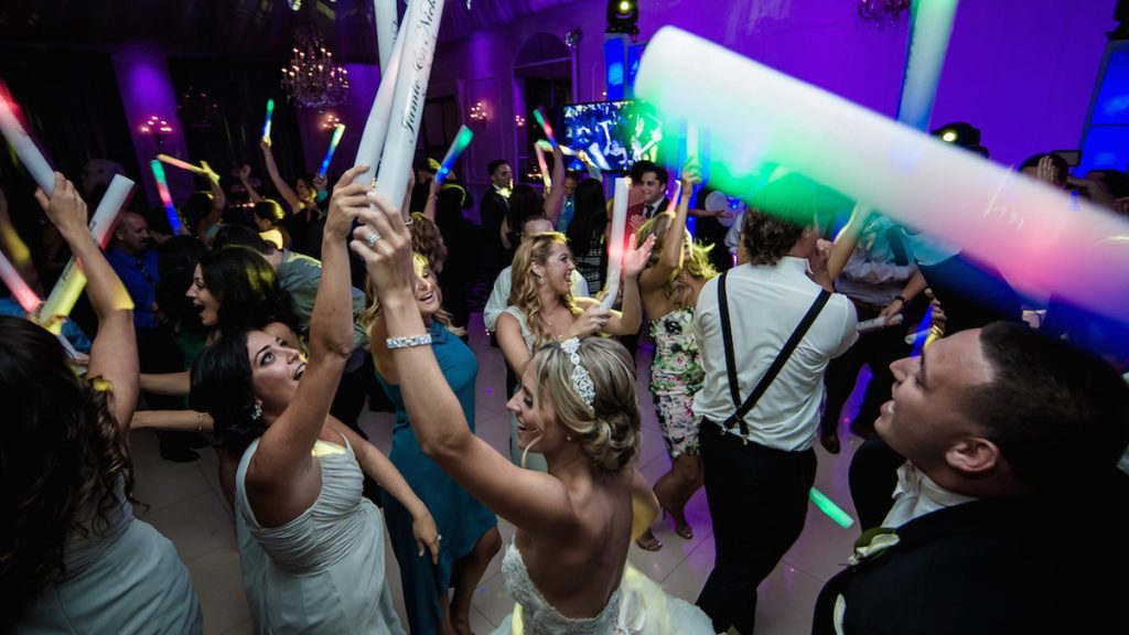 crowd on the dance floor with LED foam sticks